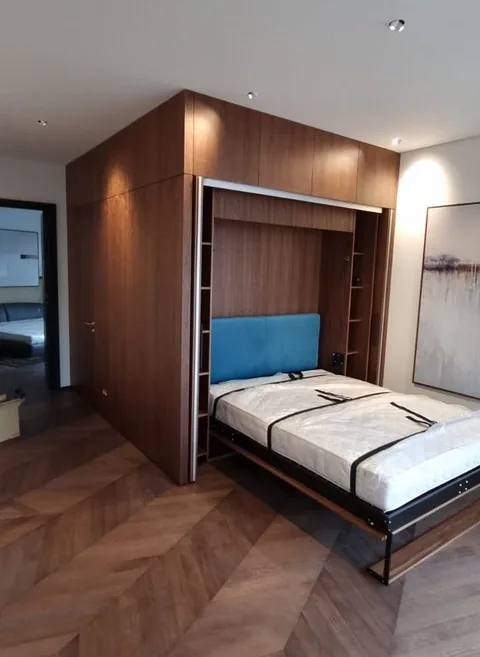 Turnkey custom furniture project in Apartment Murphy Bed Open Custom Furniture by RPGroup