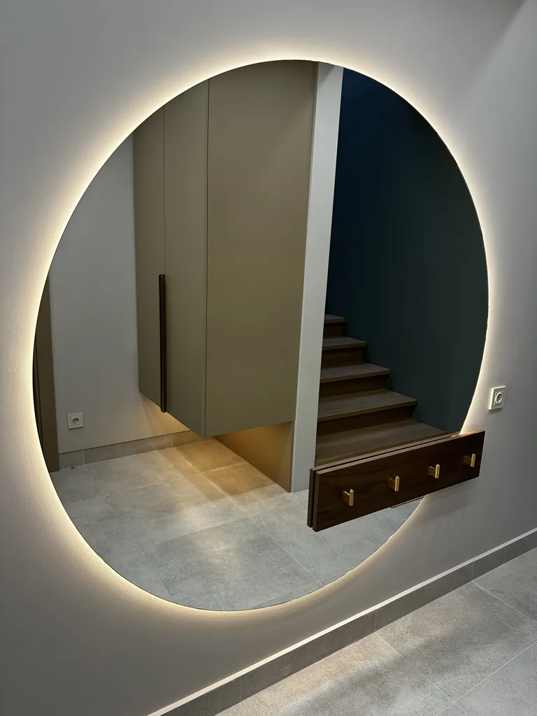 Turnkey custom furniture project in Backlit Round Mirror Vanity Cabinet by RPGroup